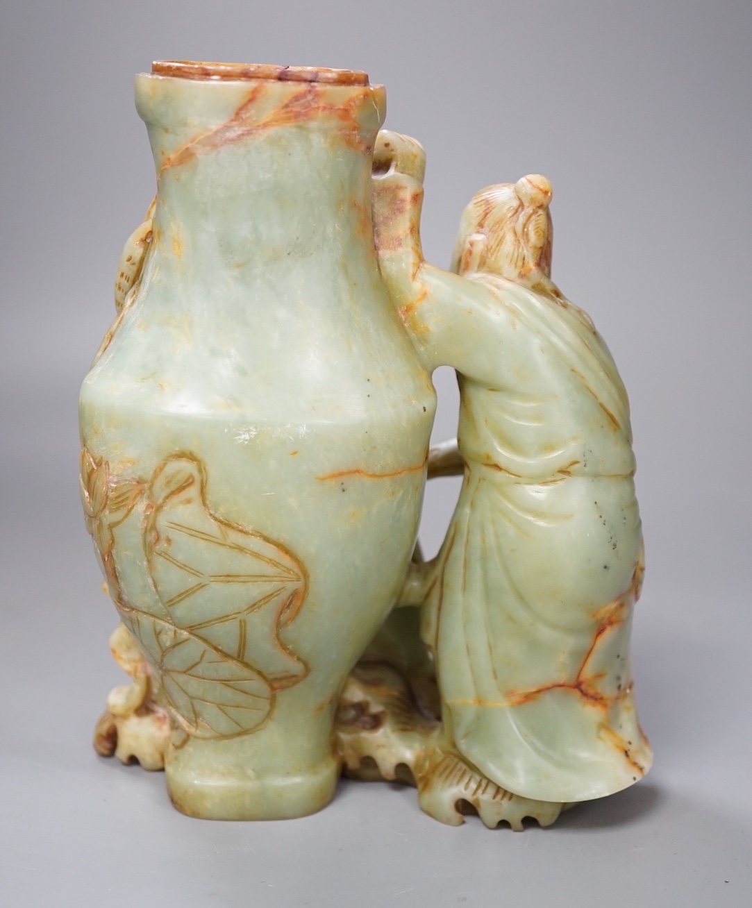 A late 19th century soapstone figural vase. 18cm